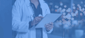 Healthcare provider using a digital tablet, representing technology-enabled care and innovation in modern healthcare settings.