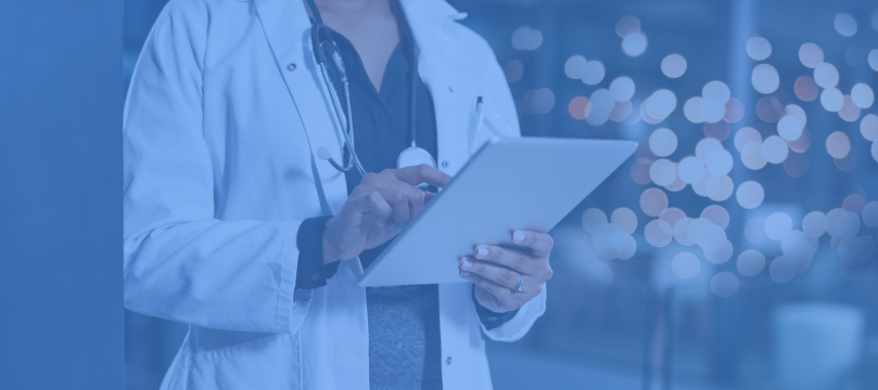 Healthcare provider using a digital tablet, representing technology-enabled care and innovation in modern healthcare settings.