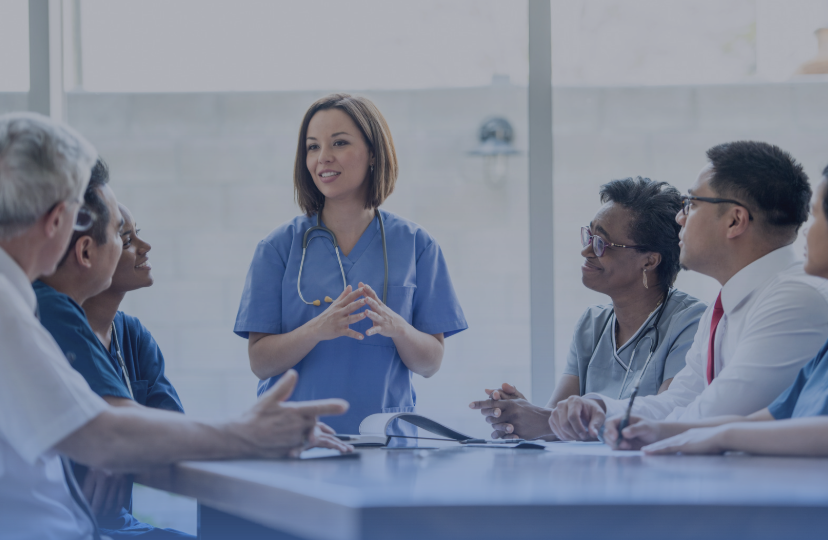 Healthcare professionals in a leadership discussion, highlighting collaboration and communication in medical settings.